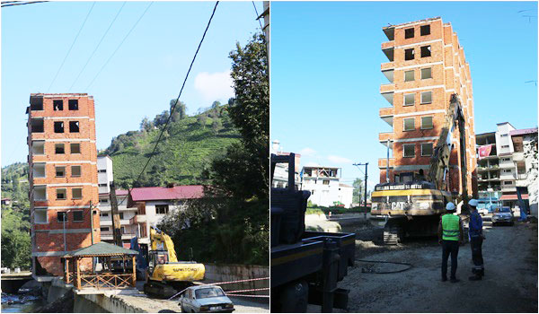 Dere yatağındaki apartmanın yıkımına başlandı